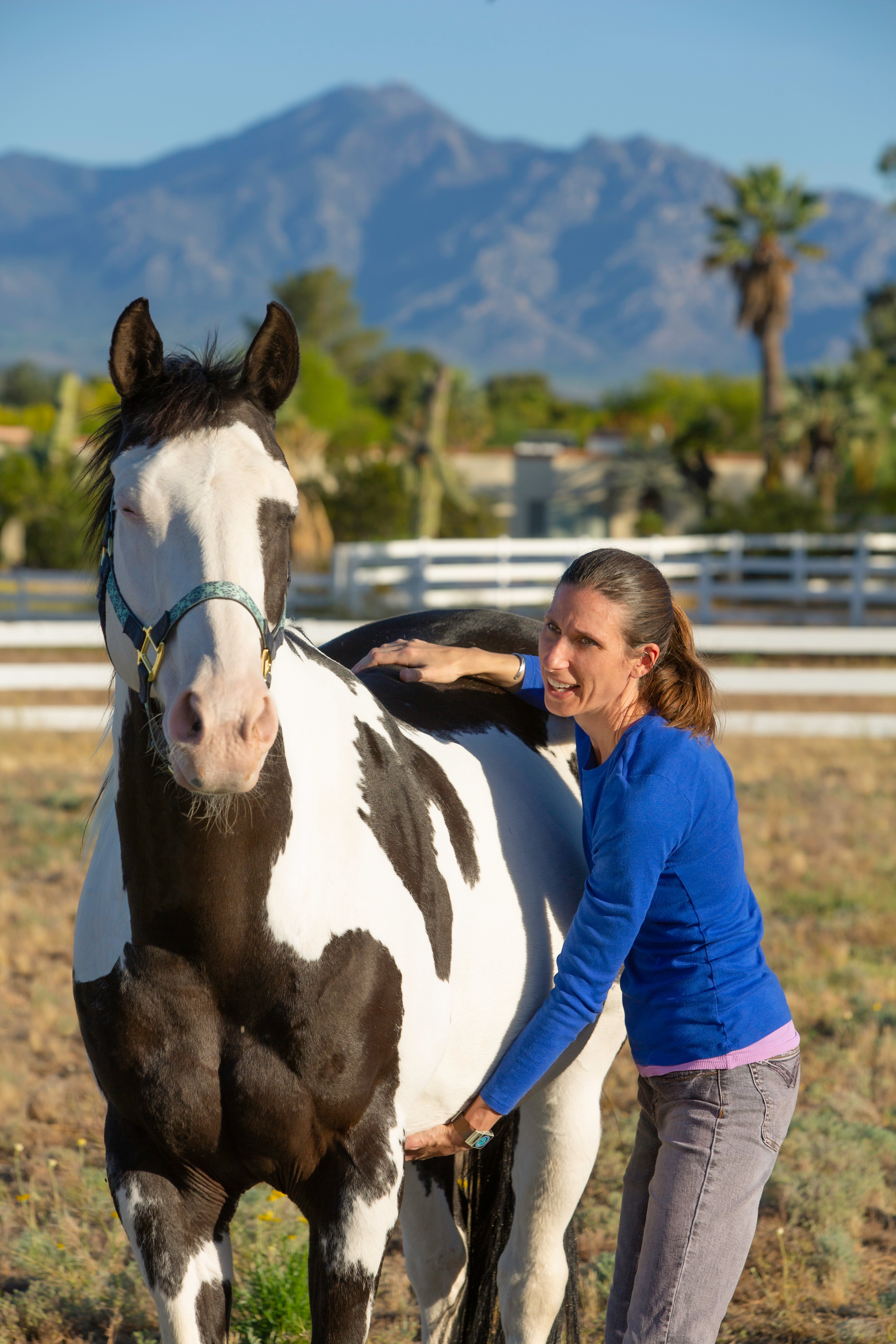 Woman performs myofascial release technique on the barrel and loin